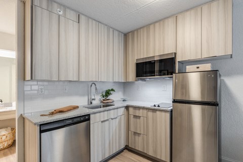 our apartments offer a modern kitchen with stainless steel appliances at The Teale, Kissimmee, FL, 34746